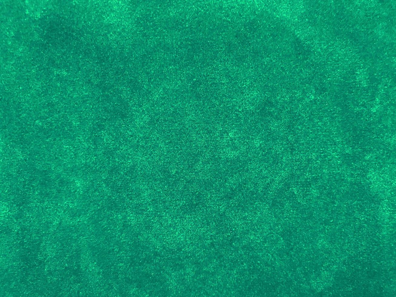 Dark green old velvet fabric texture used as background. Empty green fabric background of soft and smooth textile material. There is space for text.. photo