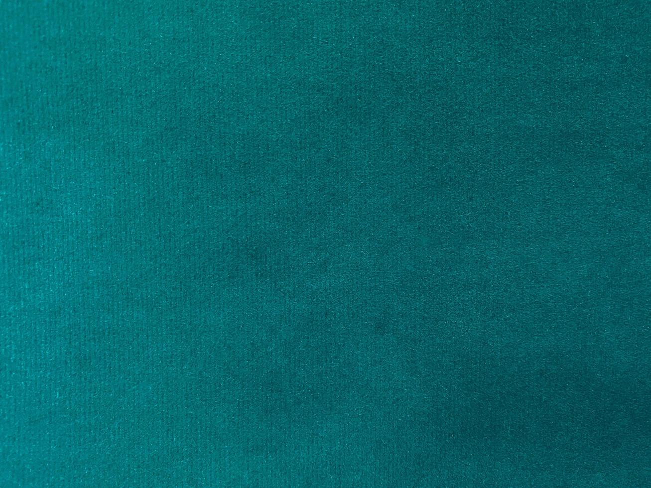 Dark green velvet fabric texture used as background. Empty dark green  fabric background of soft and smooth textile material. There is space for text. photo