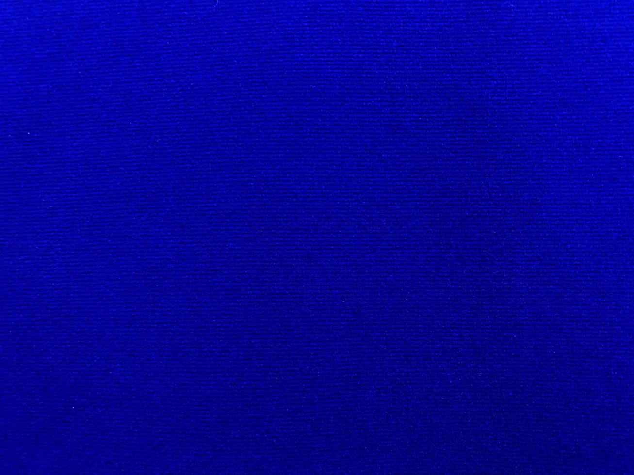 Dark blue velvet fabric texture used as background. Empty dark blue fabric background of soft and smooth textile material. There is space for text. photo