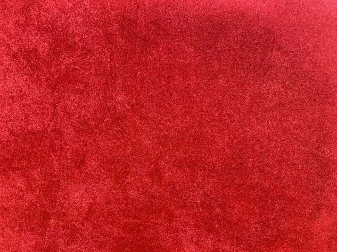 Dark red velvet fabric texture used as background. Empty dark red fabric background of soft and smooth textile material. There is space for text.. photo