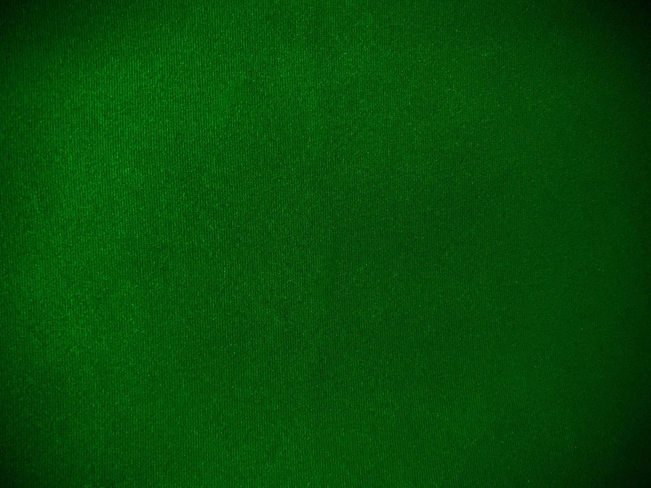 Dark green velvet fabric texture used as background. Empty green fabric background of soft and smooth textile material. There is space for text. photo