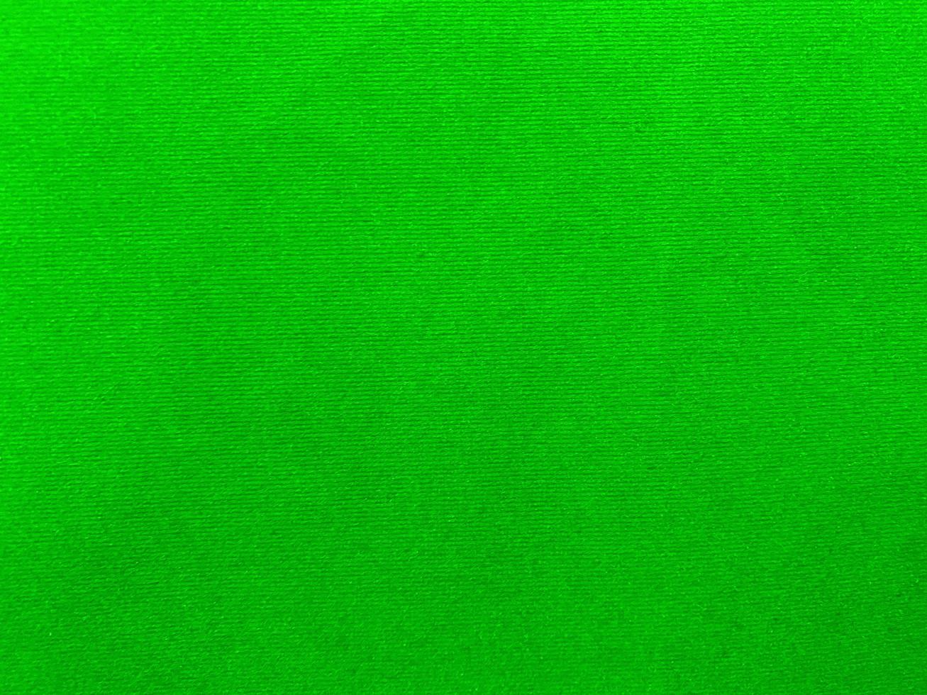 green velvet fabric texture used as background. Empty green fabric background of soft and smooth textile material. There is space for text. photo