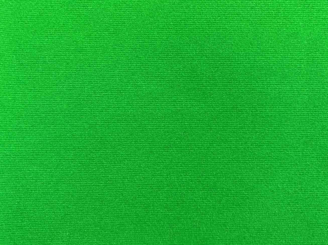 green velvet fabric texture used as background. Empty green fabric background of soft and smooth textile material. There is space for text. photo