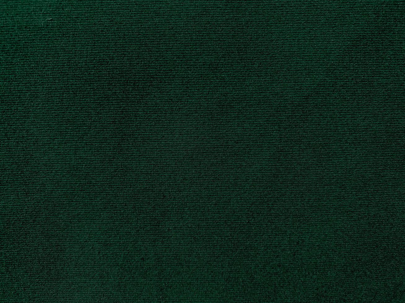 Dark green old velvet fabric texture used as background. Empty green fabric background of soft and smooth textile material. There is space for text. photo