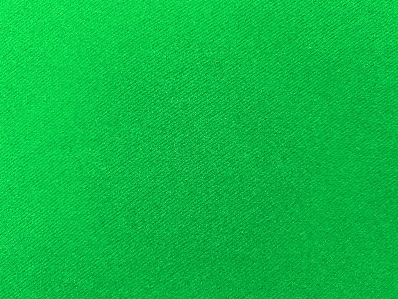 Green old velvet fabric texture used as background. Empty green fabric background of soft and smooth textile material. There is space for text.. photo