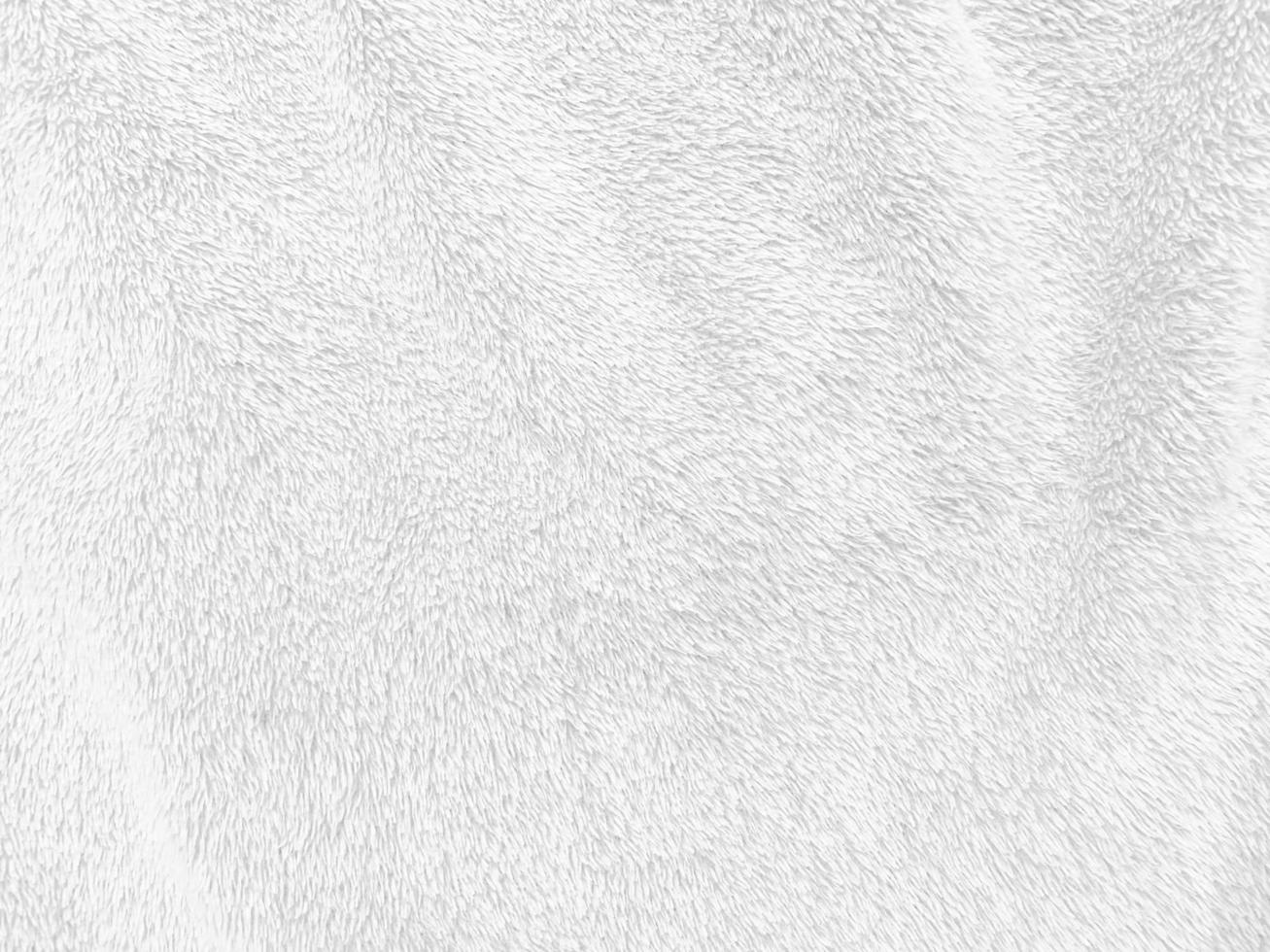 White clean wool texture background. light natural sheep wool. white seamless cotton. texture of fluffy fur for designers. close-up fragment white wool carpet. photo