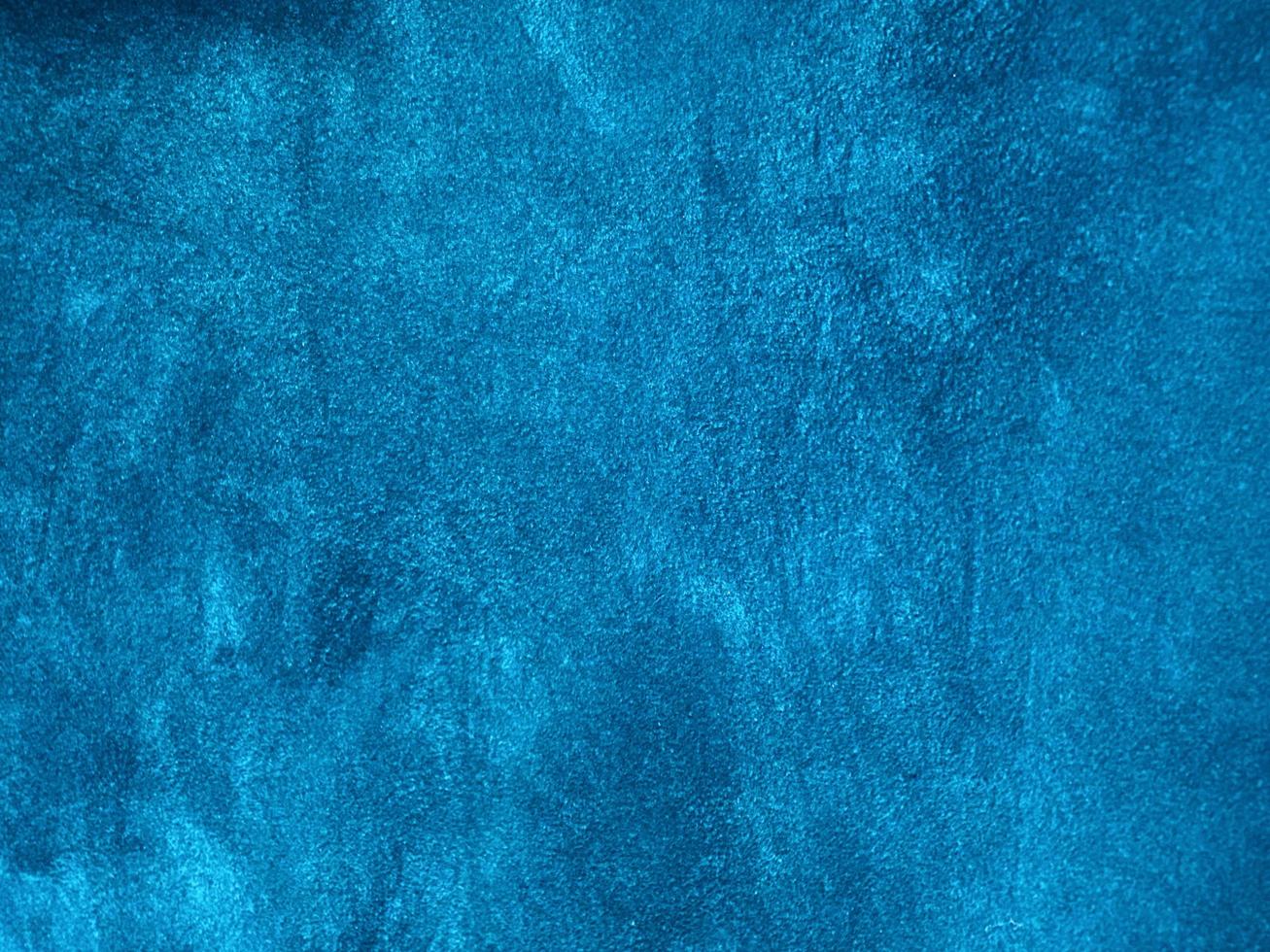 Light blue velvet fabric texture used as background. Empty blue fabric