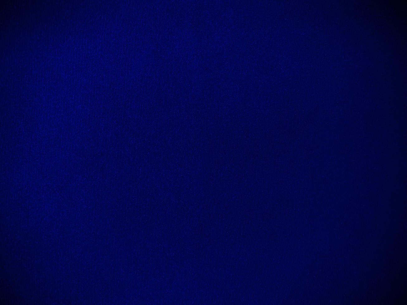 Dark blue velvet fabric texture used as background. Empty dark blue fabric background of soft and smooth textile material. There is space for text. photo
