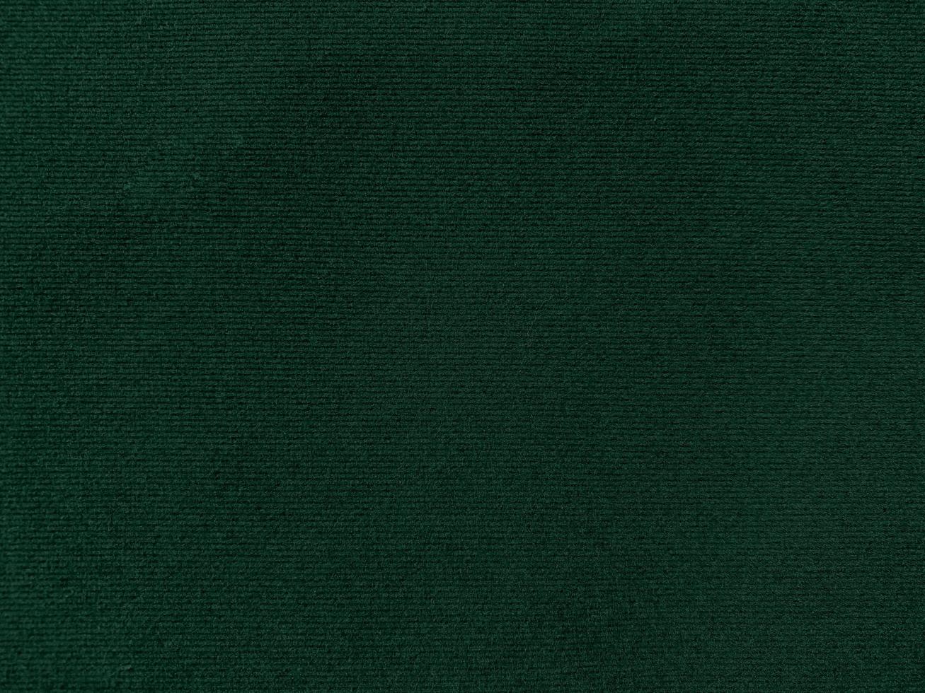 Dark green old velvet fabric texture used as background. Empty green fabric background of soft
