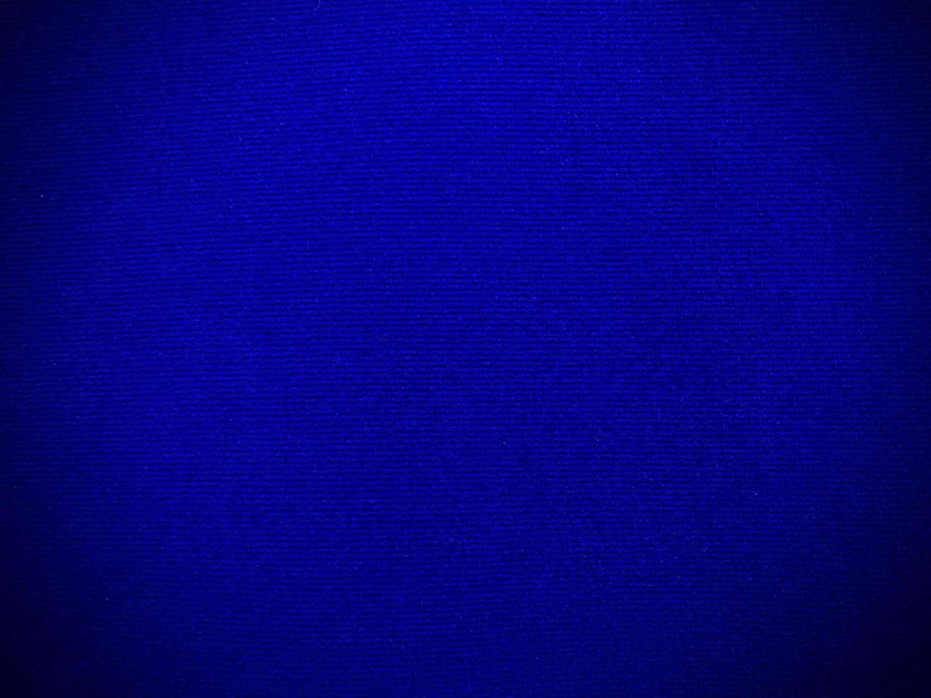 Dark blue velvet fabric texture used as background. Empty dark blue fabric background of soft and smooth textile material. There is space for text. photo
