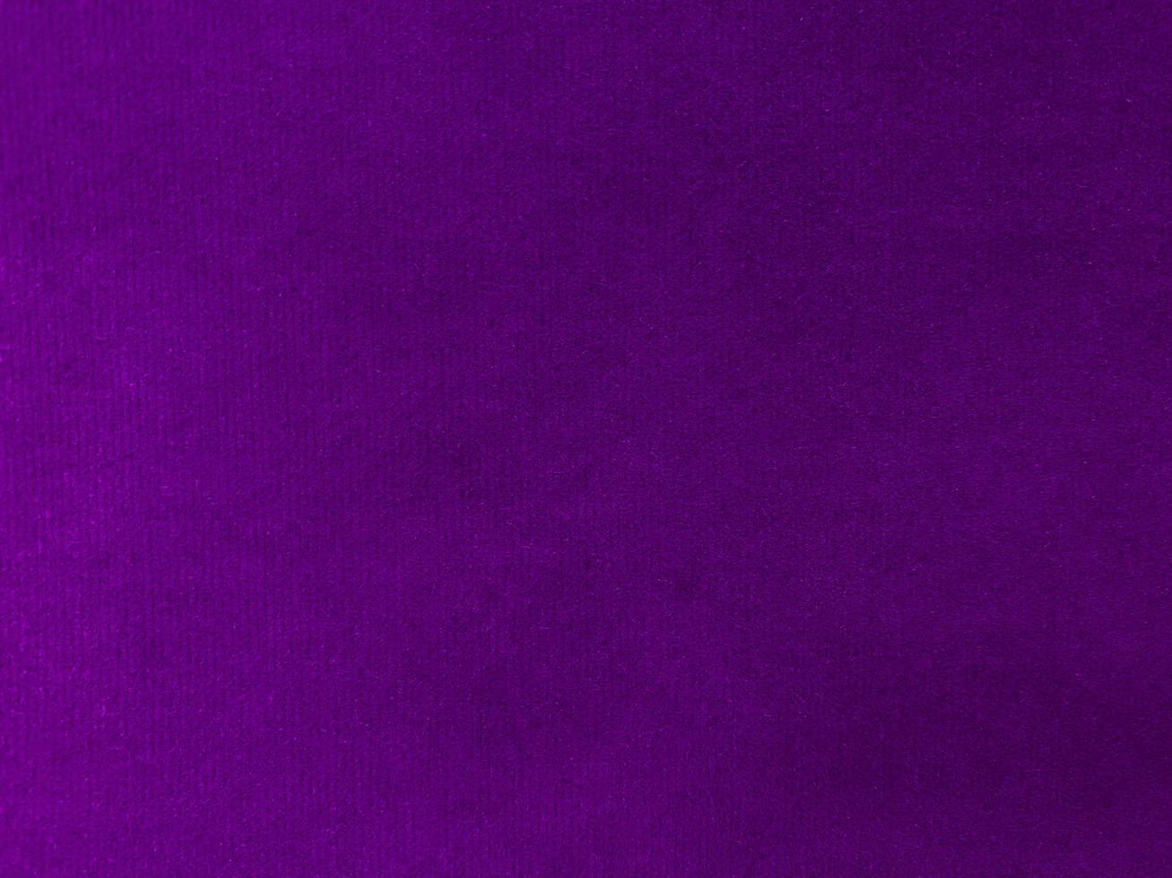 Purple velvet fabric texture used as background. Empty purple fabric background of soft and smooth textile material. There is space for text. photo