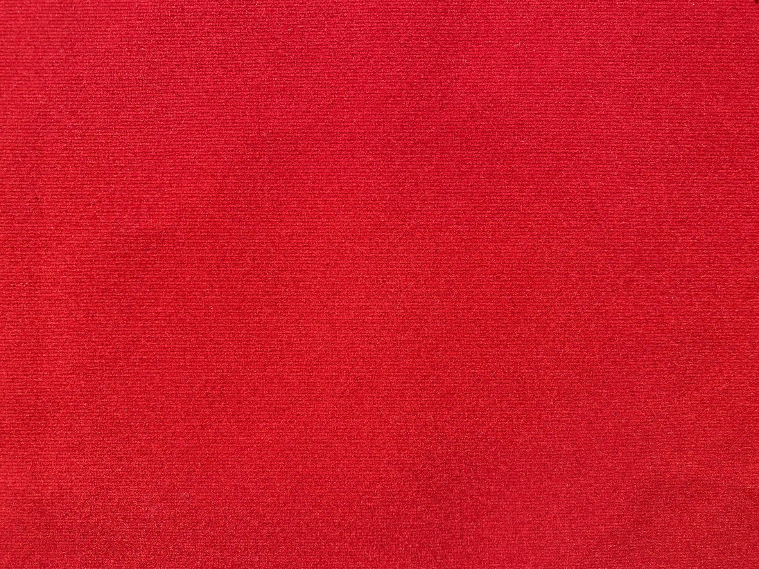 Red velvet fabric texture used as background. Empty red fabric