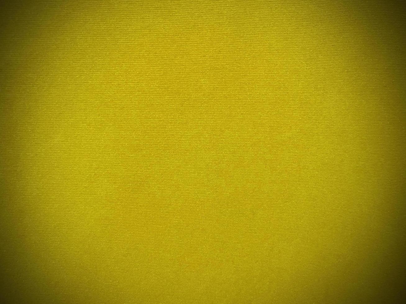 Yellow velvet fabric texture used as background. Empty yellow fabric background of soft and smooth textile material. There is space for text... photo