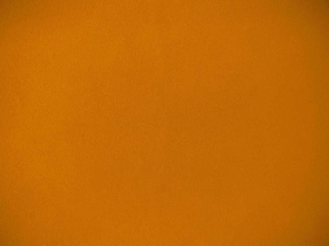 Orange velvet fabric texture used as background. Empty orange fabric background of soft and smooth textile material. There is space for text. photo