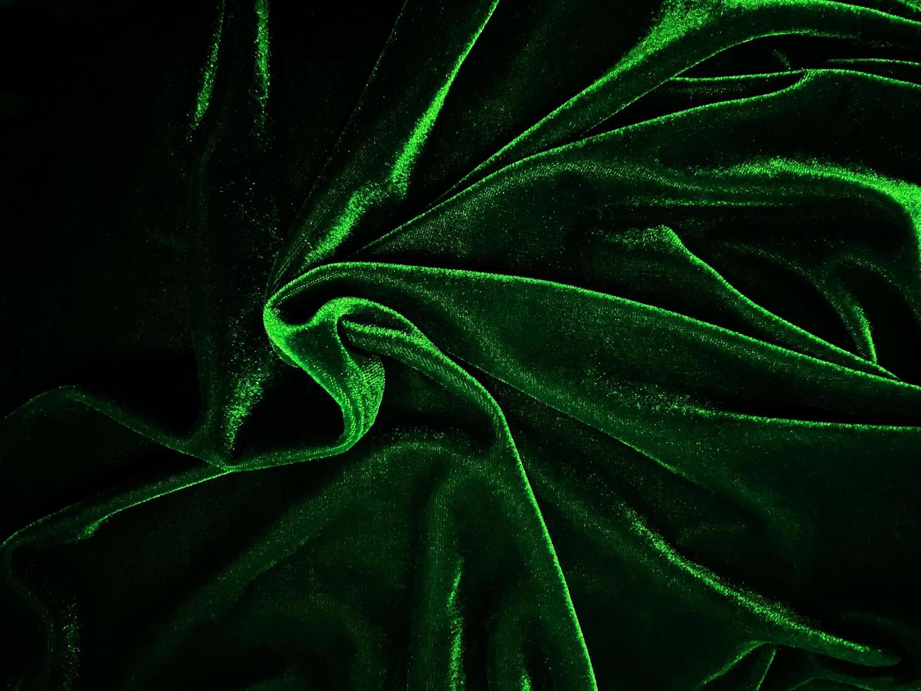 Green velvet fabric texture used as background. Empty green fabric background of soft and smooth textile material. There is space for text. photo