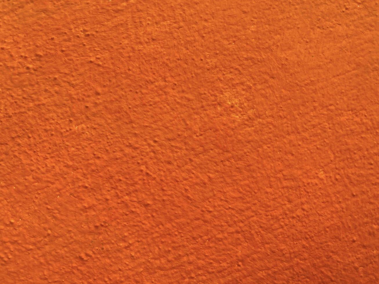 Seamless texture of orange cement wall a rough surface, with space for text, for a background. photo