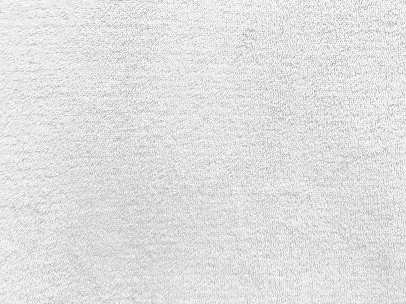 White clean wool  texture background. light natural sheep wool. white seamless cotton. texture of fluffy fur for designers. close-up fragment white wool carpet. photo