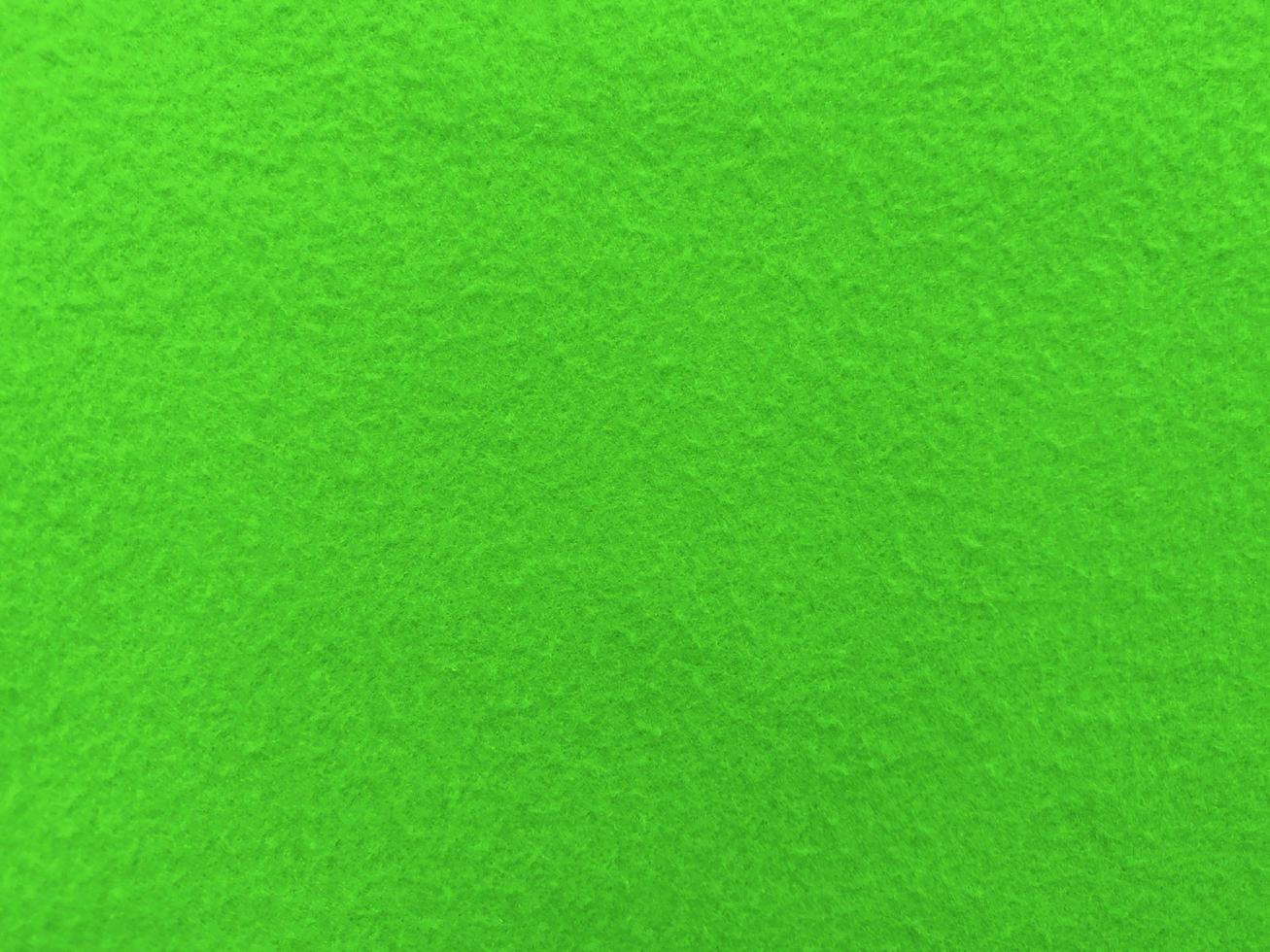 Felt green soft rough textile material background texture close up,poker table,tennis ball,table cloth. Empty green fabric background. photo