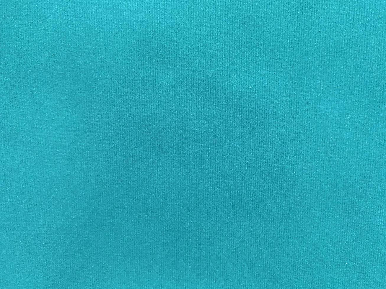turquoise velvet fabric texture used as background. Empty turquoise fabric background of soft and smooth textile material. There is space for text. photo
