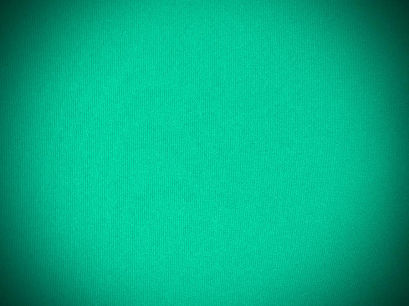 Mint green velvet fabric texture used as background. Empty green fabric background of soft and smooth textile material. There is space for text. photo