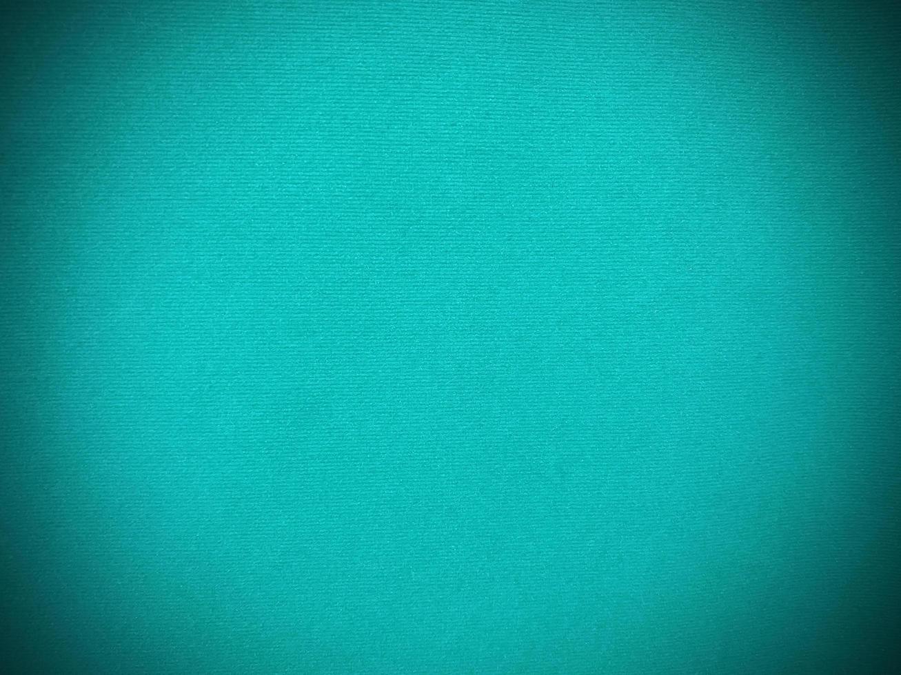 Dark green old velvet fabric texture used as background. Empty green fabric background of soft and smooth textile material. There is space for text... photo