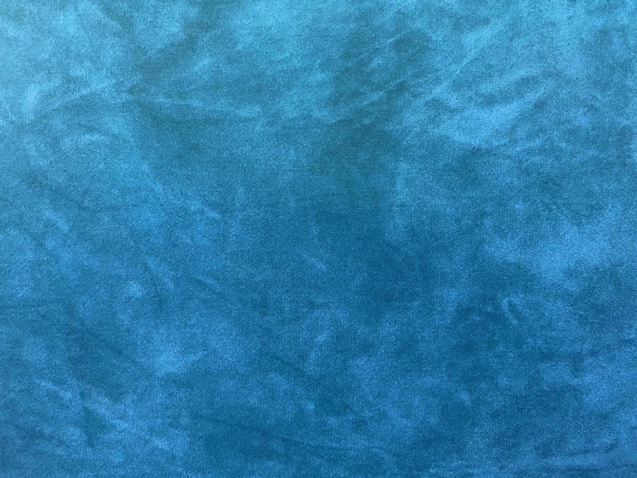Light blue velvet fabric texture used as background. Empty light blue