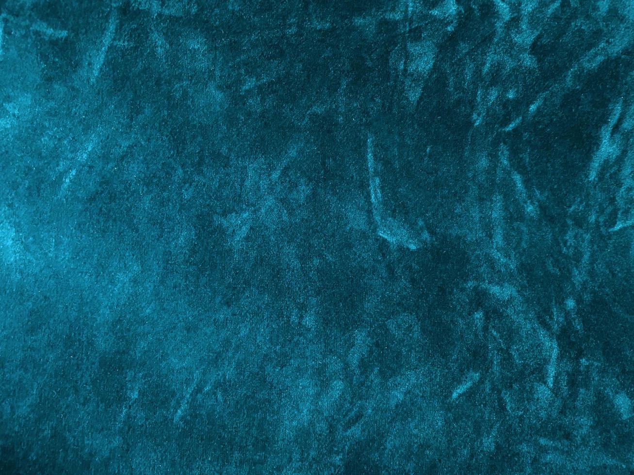 Dark blue marine velvet fabric texture used as background. Empty dark