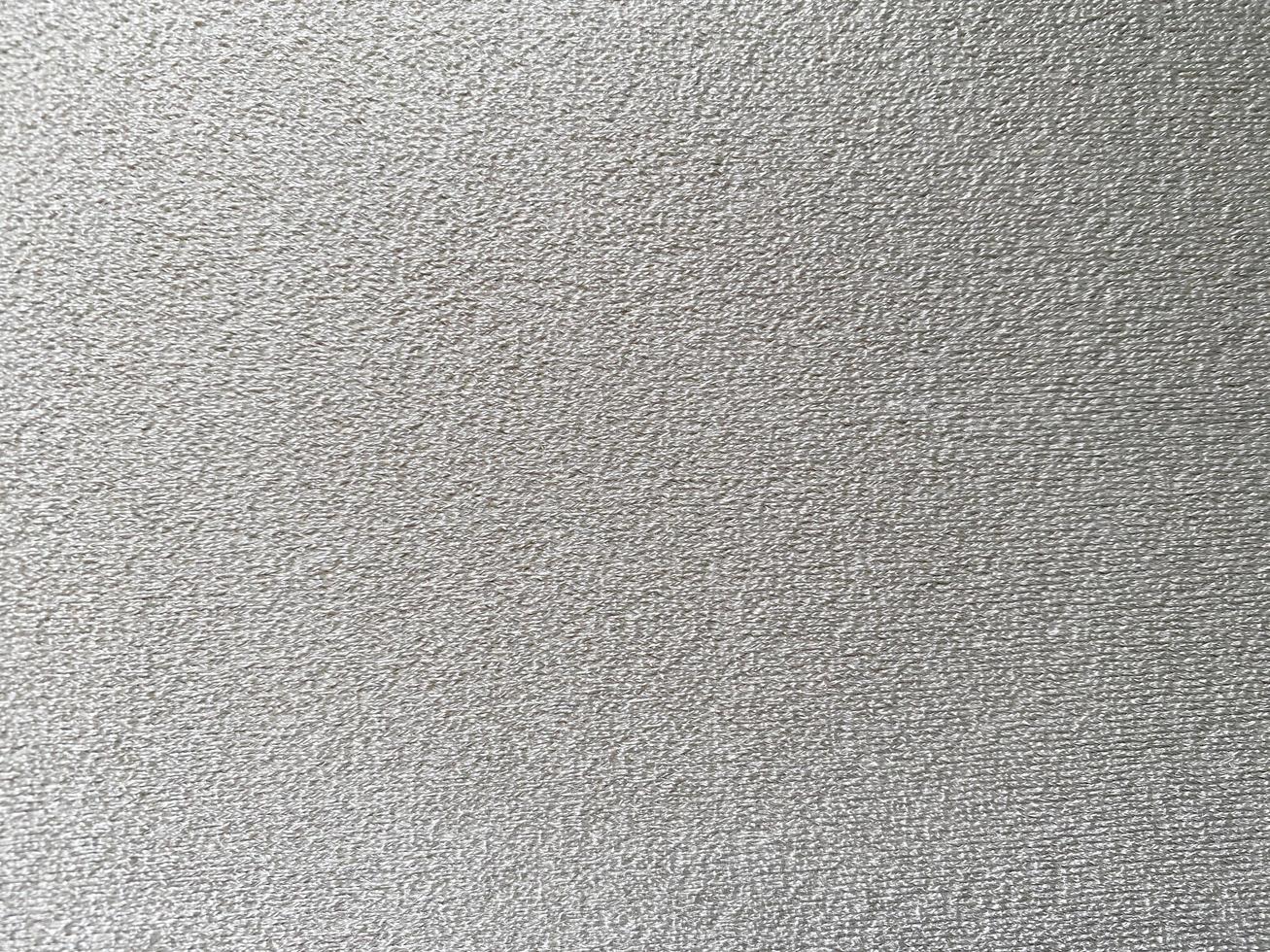 White clean wool texture background. light natural sheep wool. white seamless cotton. texture of fluffy fur for designers. close-up fragment white wool carpet. photo