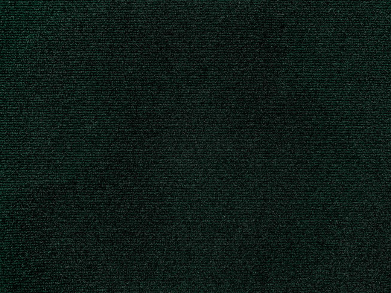 Dark green old velvet fabric texture used as background. Empty green fabric background of soft and smooth textile material. There is space for text. photo