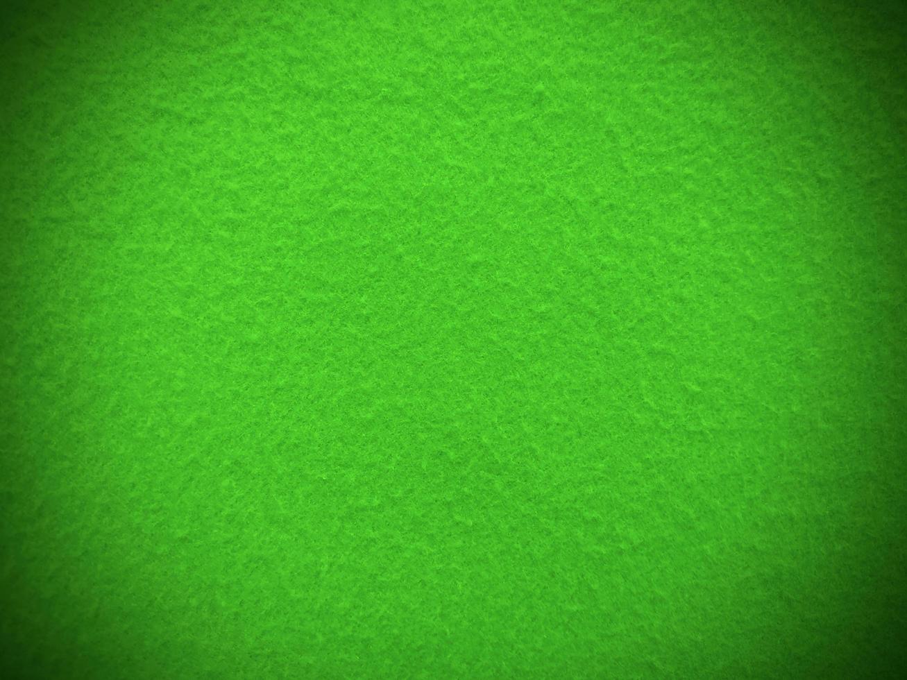 Felt green soft rough textile material background texture close up,poker table,tennis ball,table cloth. Empty green fabric background. photo