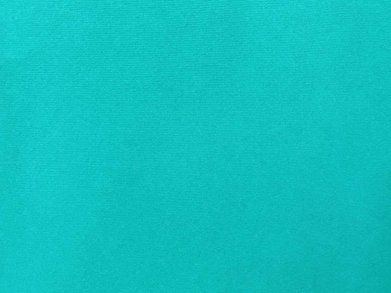 Dark green old velvet fabric texture used as background. Empty green fabric background of soft and smooth textile material. There is space for text... photo