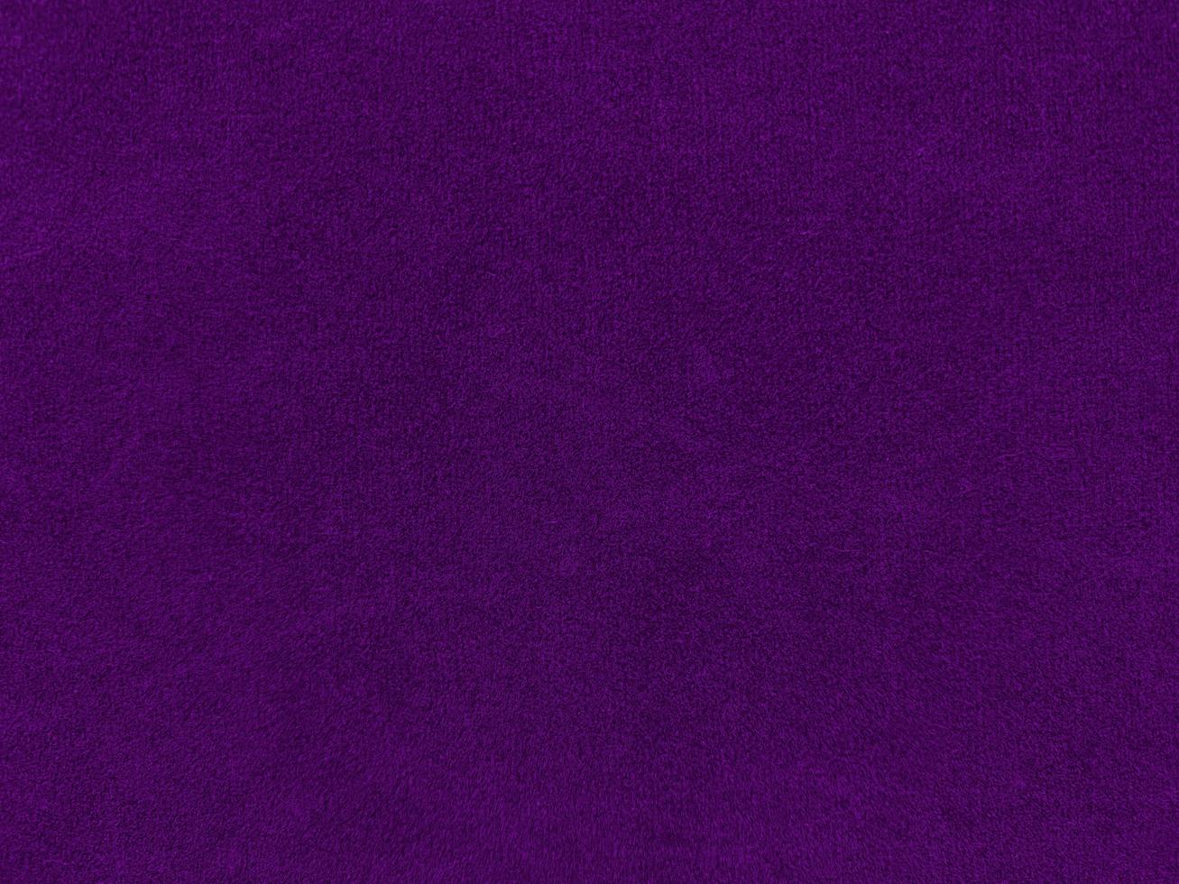 Purple velvet fabric texture used as background. Empty purple fabric background of soft and smooth textile material. There is space for text. photo