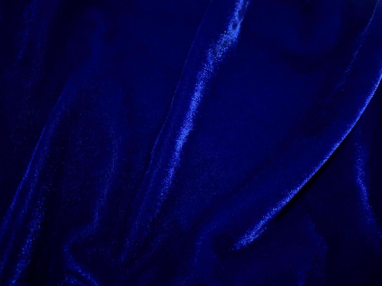 Blue velvet fabric texture used as background. Empty Bluefabric background of soft and smooth textile material. There is space for text. photo