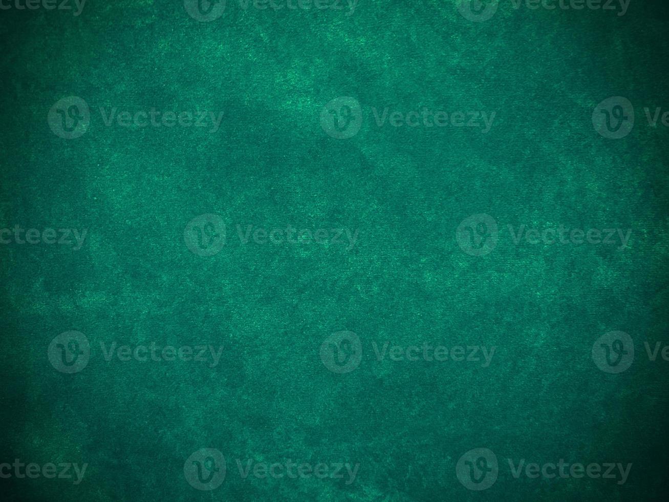 Dark green old velvet fabric texture used as background. Empty green fabric background of soft and smooth textile material. There is space for text... photo