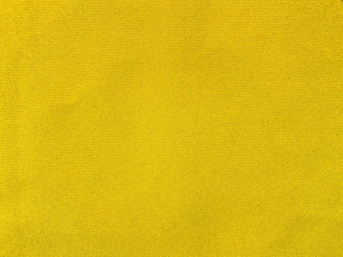Yellow velvet fabric texture used as background. Empty yellow fabric background of soft and smooth textile material. There is space for text. photo