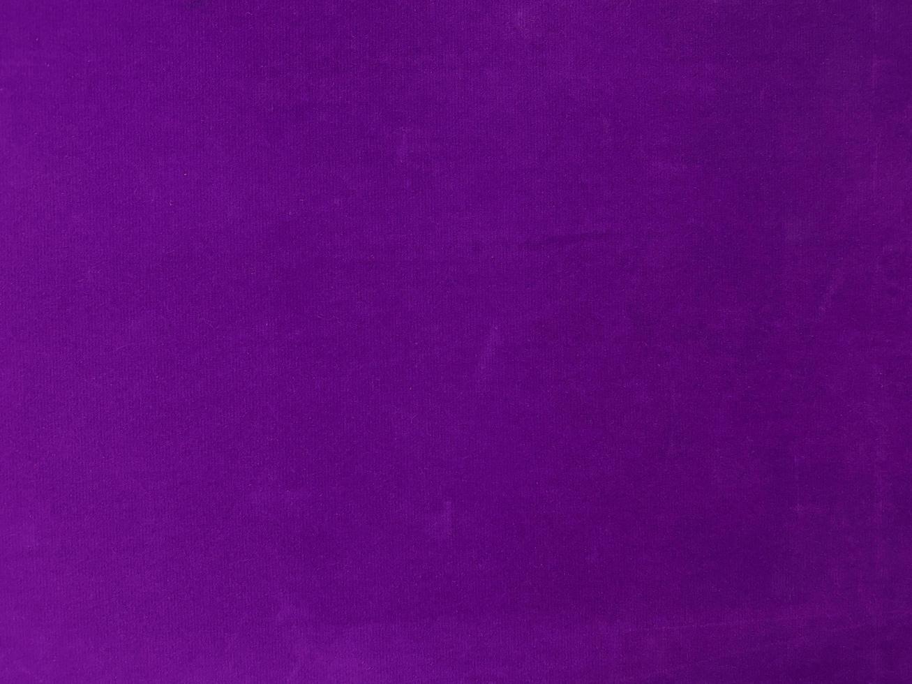 Purple velvet fabric texture used as background. Empty purple fabric background of soft and smooth textile material. There is space for text. photo