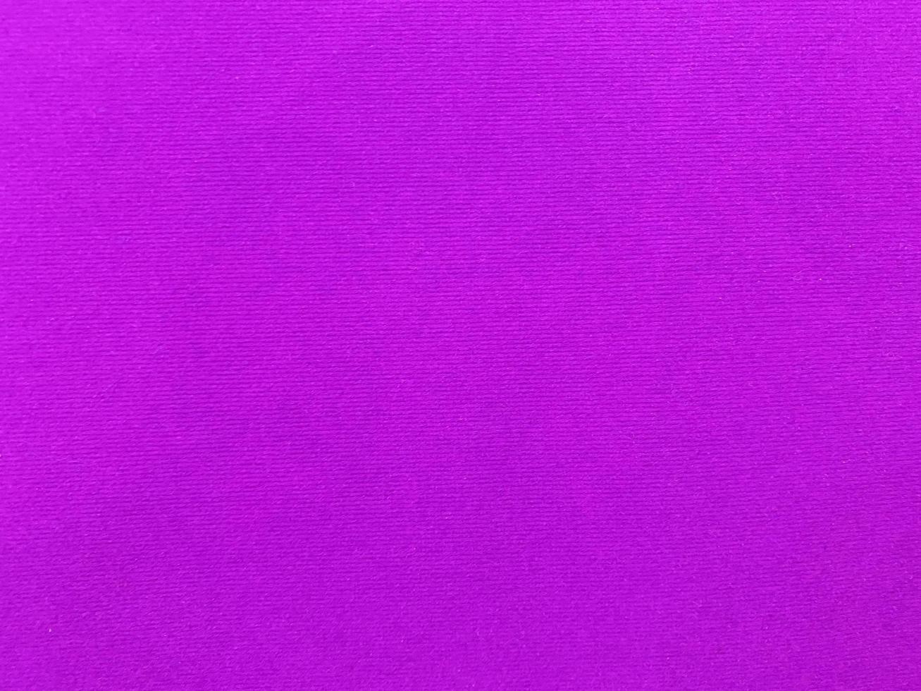 Purple velvet fabric texture used as background. Empty violet fabric background of soft and smooth textile material. There is space for text. photo