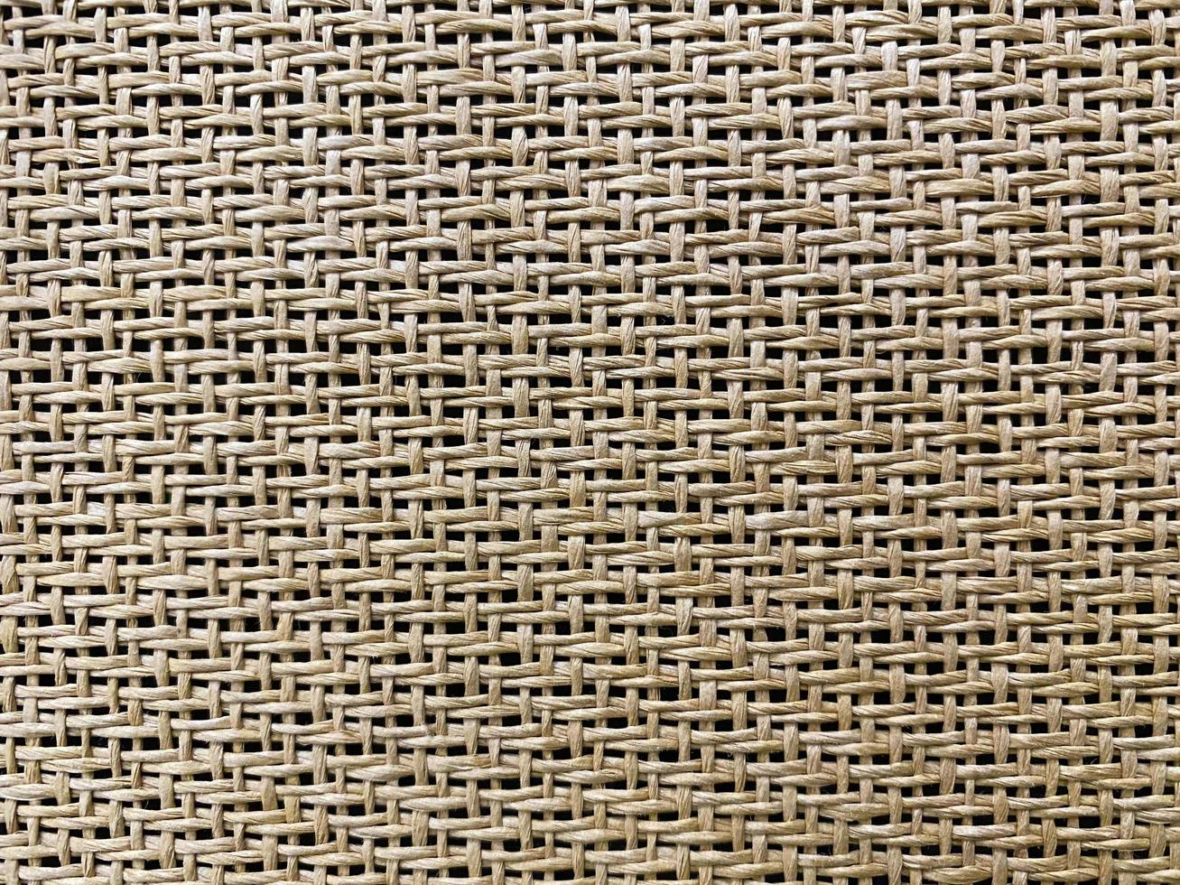 Close up  The  is woven into a net. natura rope texture as a background. Full frame of tightly woven rope pattern.with space for text, for a background. photo
