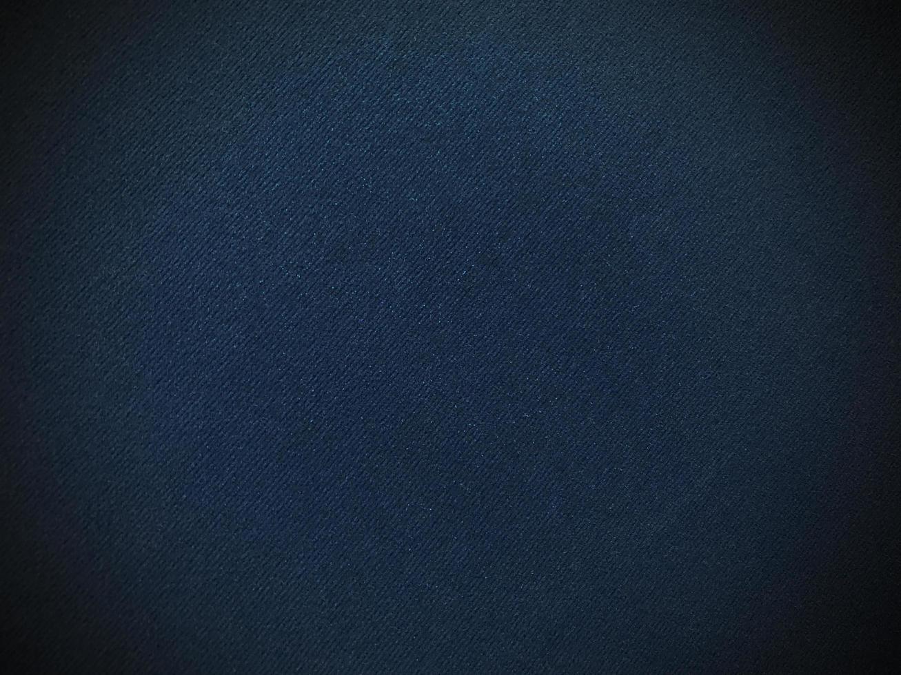 Dark blue velvet fabric texture used as background. Empty dark blue fabric background of soft and smooth textile material. There is space for text.. photo