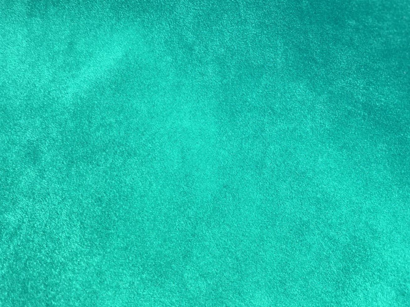 Dark green old velvet fabric texture used as background. Empty green fabric background of soft and smooth textile material. There is space for text... photo