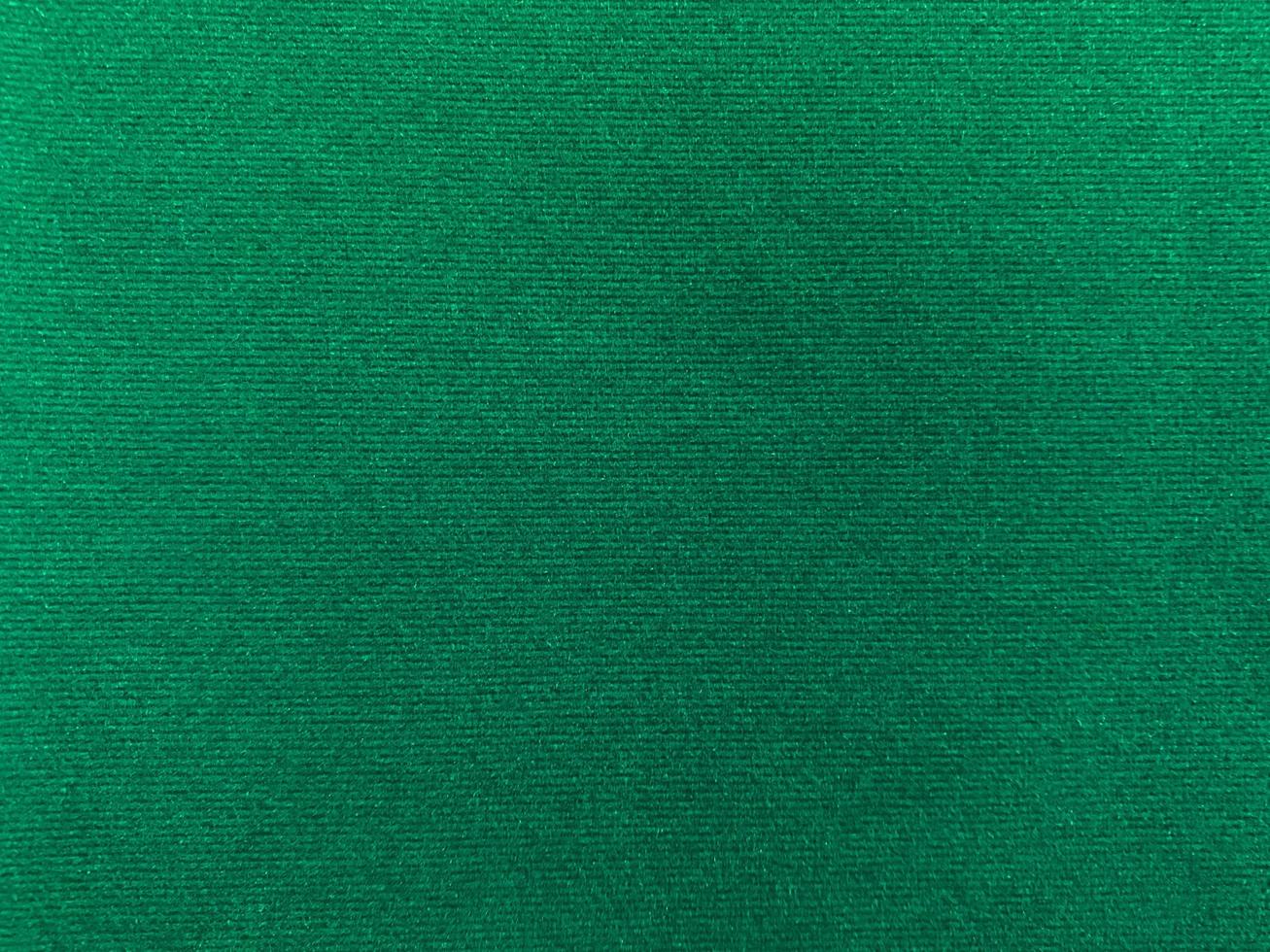 Dark green velvet fabric texture used as background. Empty green fabric background of soft and smooth textile material. There is space for text. photo