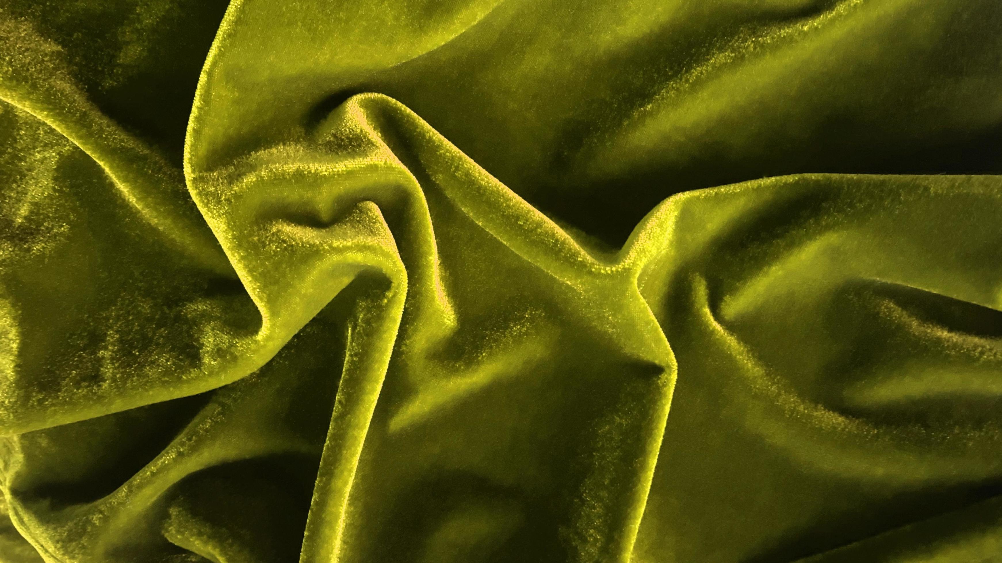 Yellow velvet fabric texture used as background. Empty yellow fabric