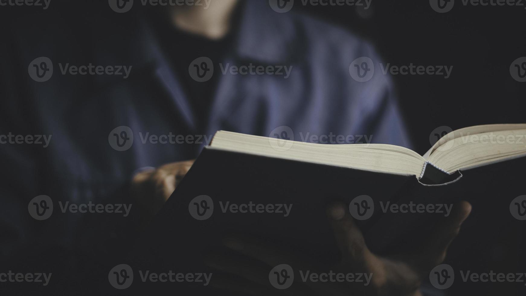 Businessman holding a book or bible to read think problem solving. business competition planning teamwork,International book, ideas and competition and strategy, business success concept photo