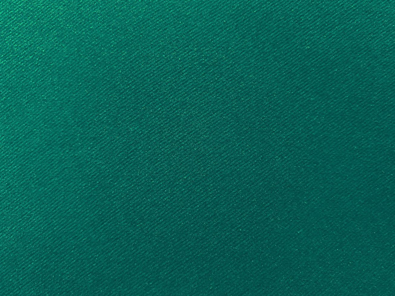 Dark green old velvet fabric texture used as background. Empty green fabric background of soft and smooth textile material. There is space for text... photo