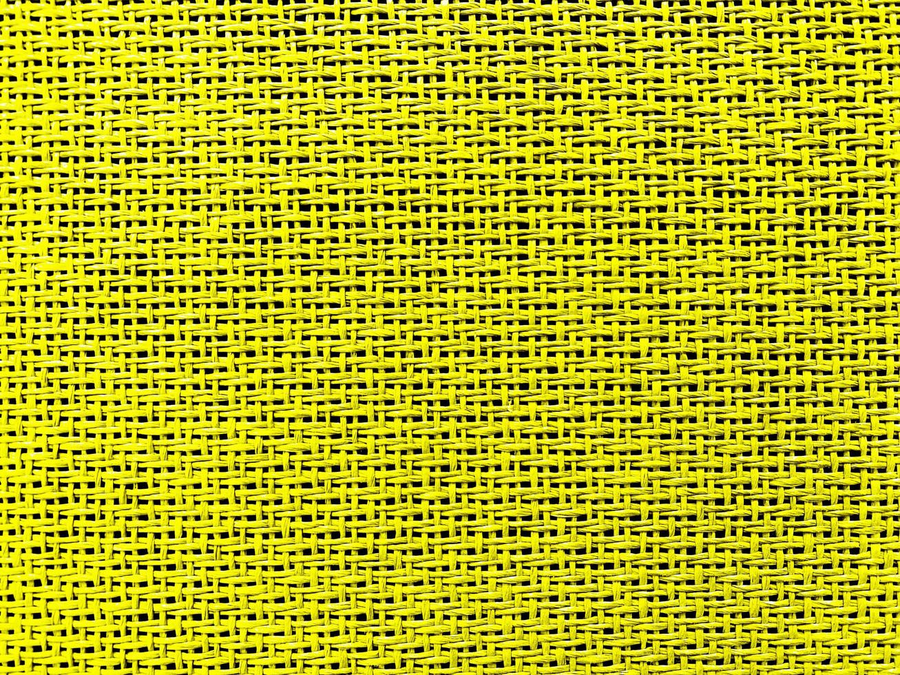 Close up yellow The  is woven into a net. natura rope texture as a background. Full frame of tightly woven rope pattern.with space for text, for a background. photo