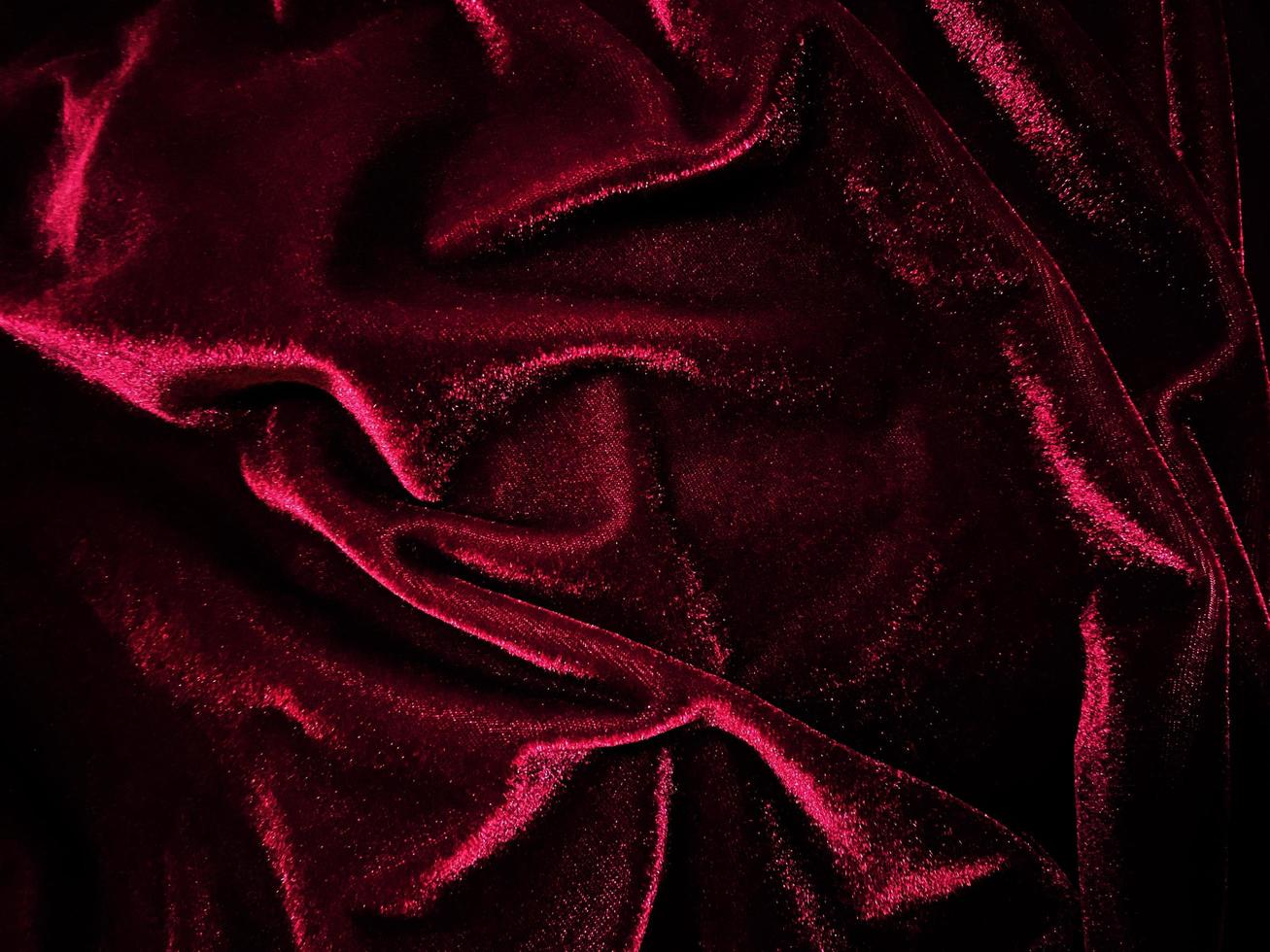 Red velvet fabric texture used as background. Empty red fabric background of soft and smooth textile material. There is space for text. photo