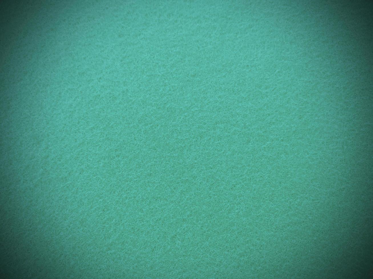 Felt mint green soft rough textile material background texture close up,poker table,tennis ball,table cloth. Empty mint fabric background. photo