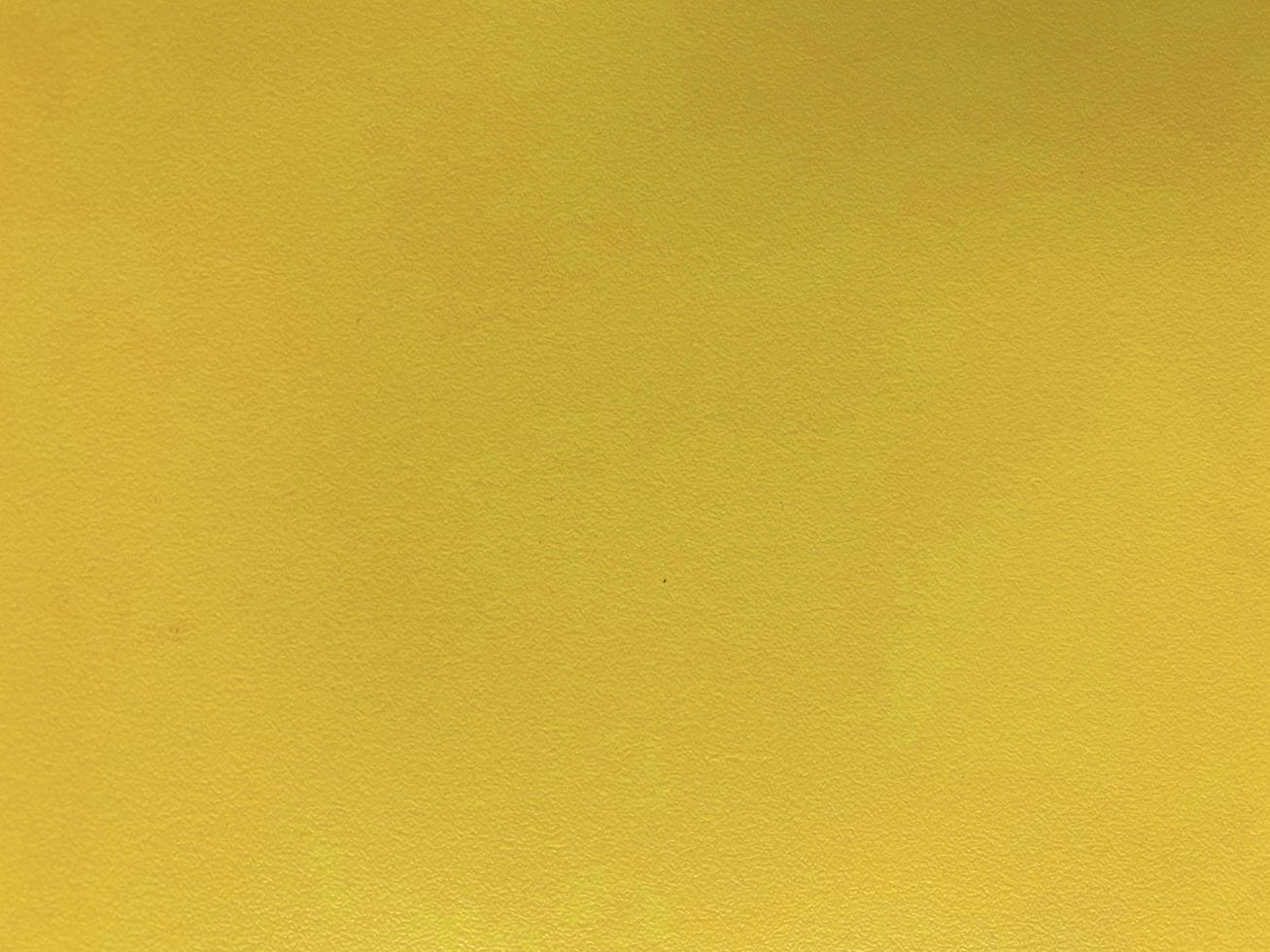 Seamless texture of yellow cement wall a rough surface, with space for text, for a background. photo