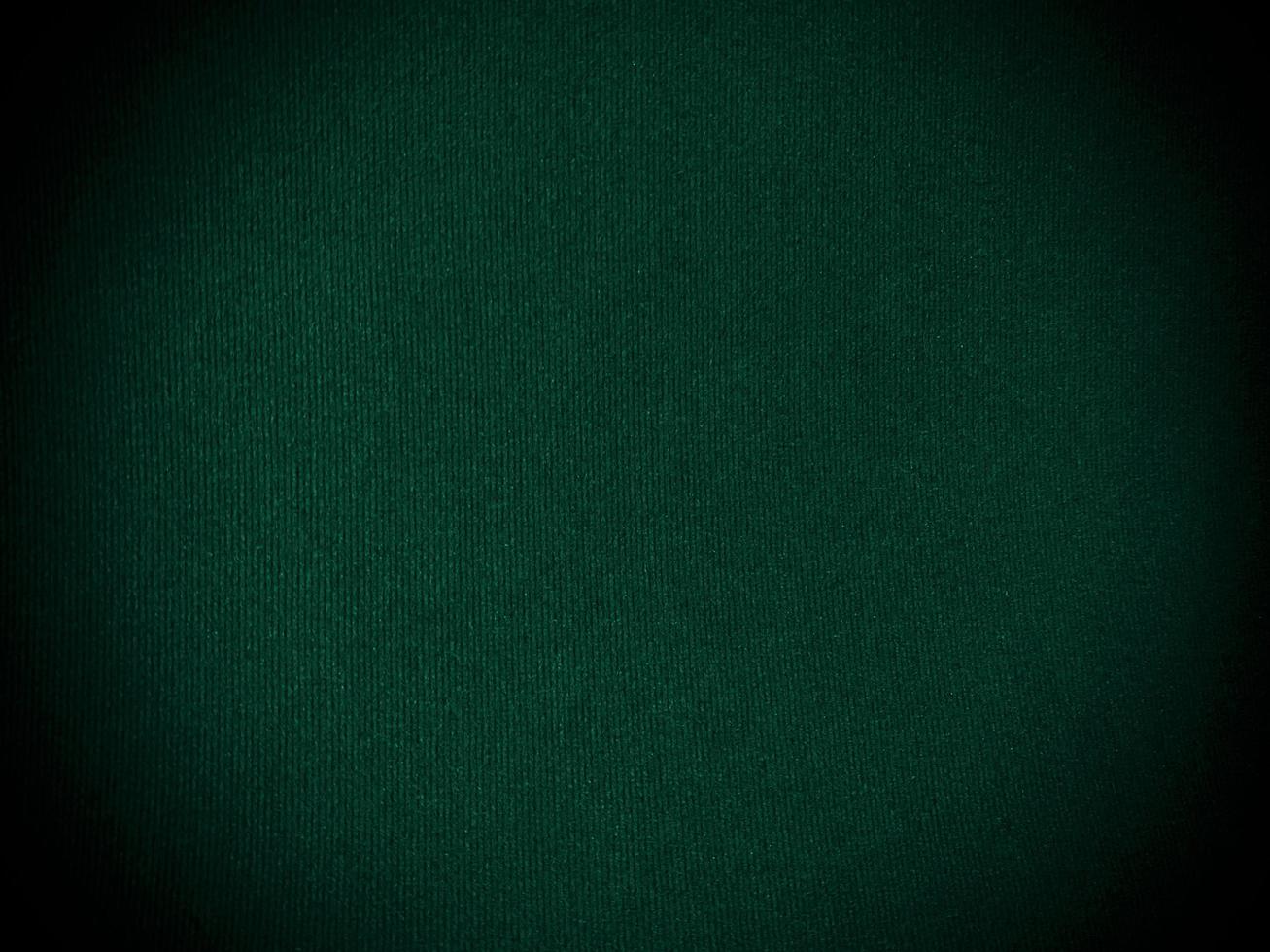 Dark green old velvet fabric texture used as background. Empty green fabric background of soft and smooth textile material. There is space for text... photo