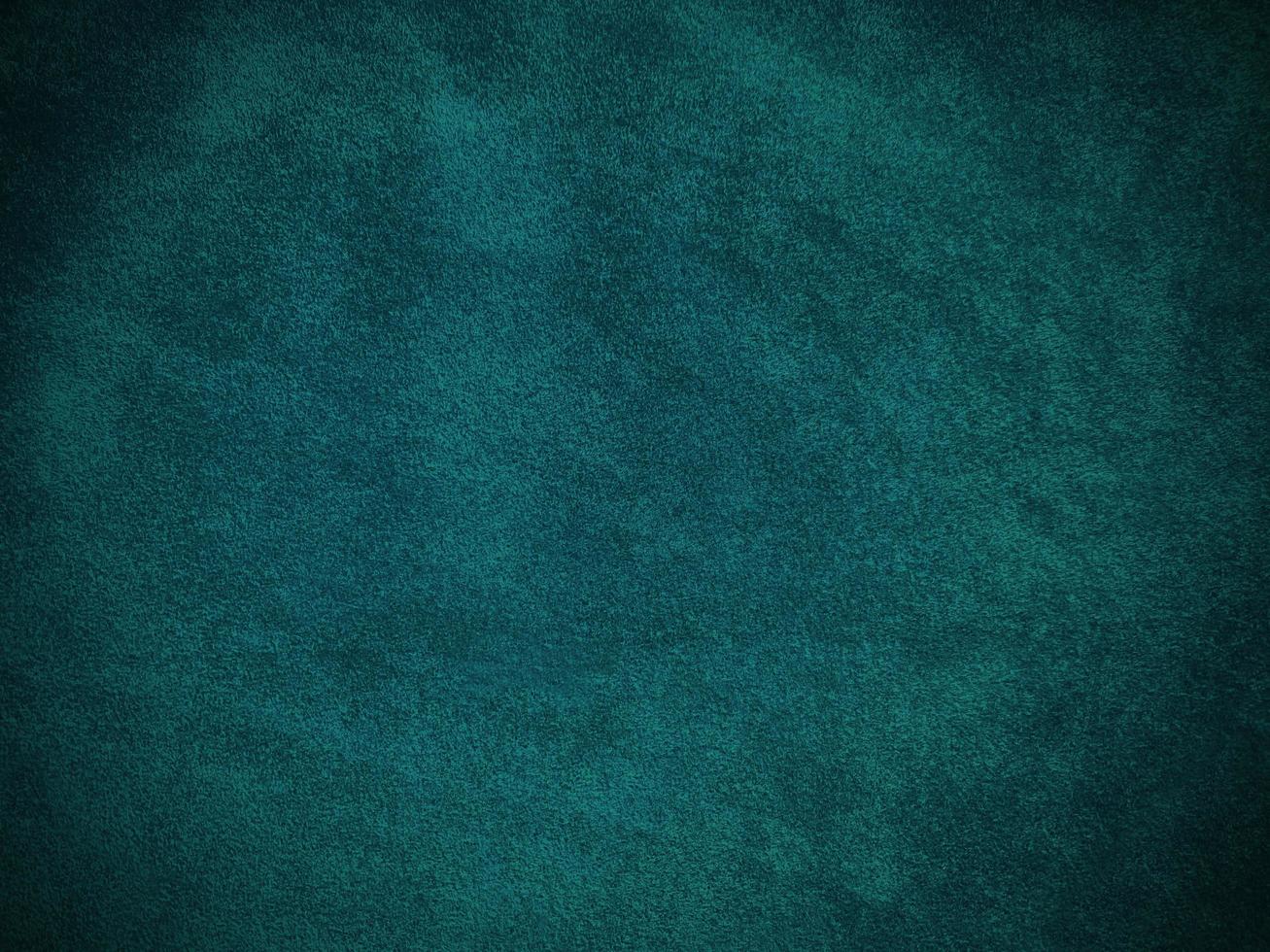 Dark green old velvet fabric texture used as background. Empty green fabric background of soft and smooth textile material. There is space for text. photo